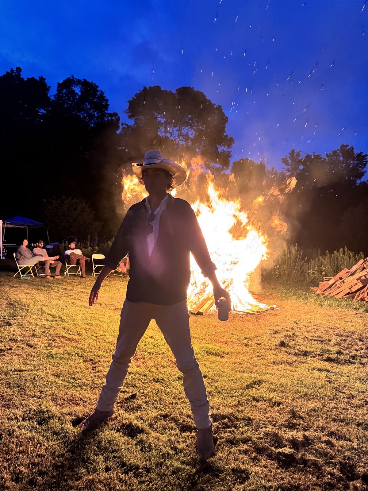 A figure against the bonfire