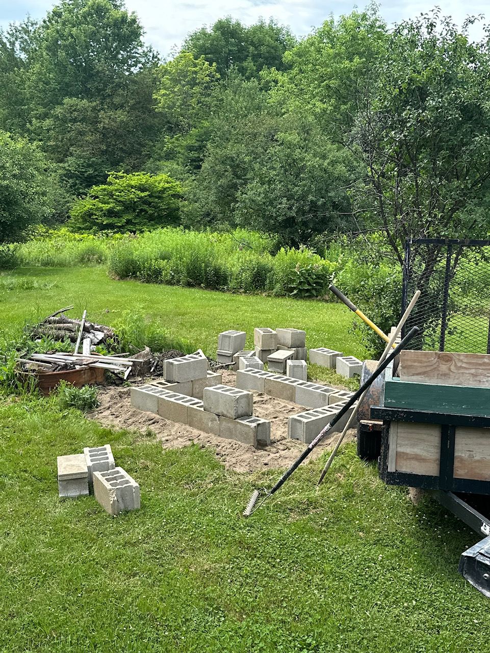 The empty cinderblock pit
